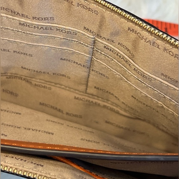 Michael Kors, orange and tan clutch with zipper. In great condition. LIKE NEW!! - Picture 13 of 13
